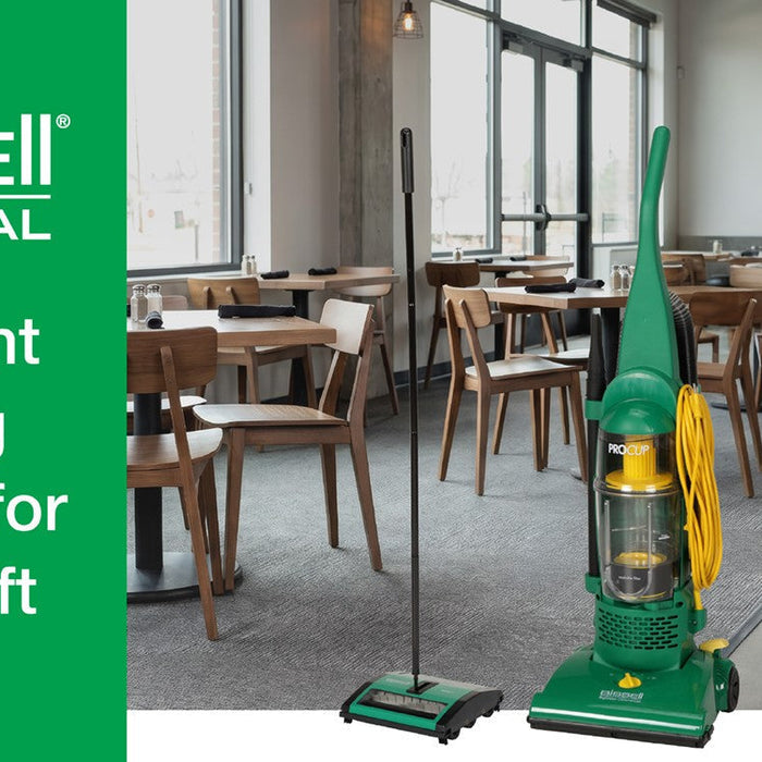 BISSELL Commercial restaurant cleaning equipment, including an upright vacuum, floor sweeper, and floor machine, displayed inside a restaurant dining area.